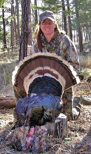 With the help of a box call and a .12-gauge shotgun, Heather Gonzales got this gobbler in the Cibola National Forest. She had to reposition once after fly down to call it in. New Mexico Wildlife magazine, NMDGF