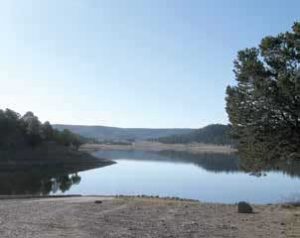 Trout are the primary sport fish at Quemado Lake (bottom), which sits at nearly 8,000 feet above sea level and provides a picturesque scene for those looking for some tranquility. New Mexico Wildlife magazine, NMDGF