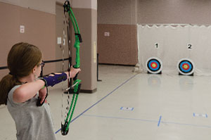 Sophie Walker, a fourth-grader at Maggie Cordova Elementary, got involved in archery when her mother got tired of buying Nerf bows and arrows and got Sophie the real thing. 