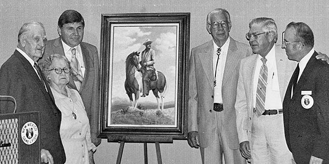 Elliott Barker (left), wife Ethel, Gov. Bruce King and Harold Olson (far right) unveil portrait of Barker on horseback. Photo: NMDGF. New Mexico Wildlife Magazine, Vol-48, Num-3 Fall 2003. (Making Tracks: A Century of Wildlife Management. (History of the New Mexico Department of Game and Fish).