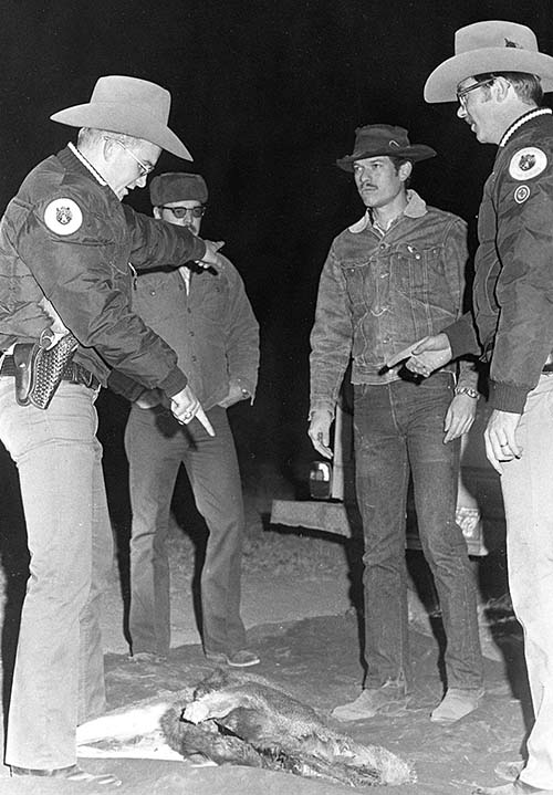 Jim Vaught, second from right, played the bad guy in a spotlighting scenario. Photo: NMDGF. New Mexico Wildlife magazine, Vol-49, Num-1 Spring 2004. (Making Tracks: A Century of Wildlife Management. (History of the New Mexico Department of Game and Fish).