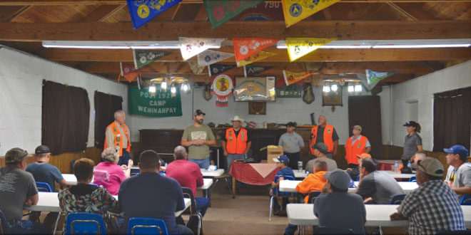 Hunter education instructors review the camp agenda and expectations at Camp Wehinahpay near Cloudcroft.