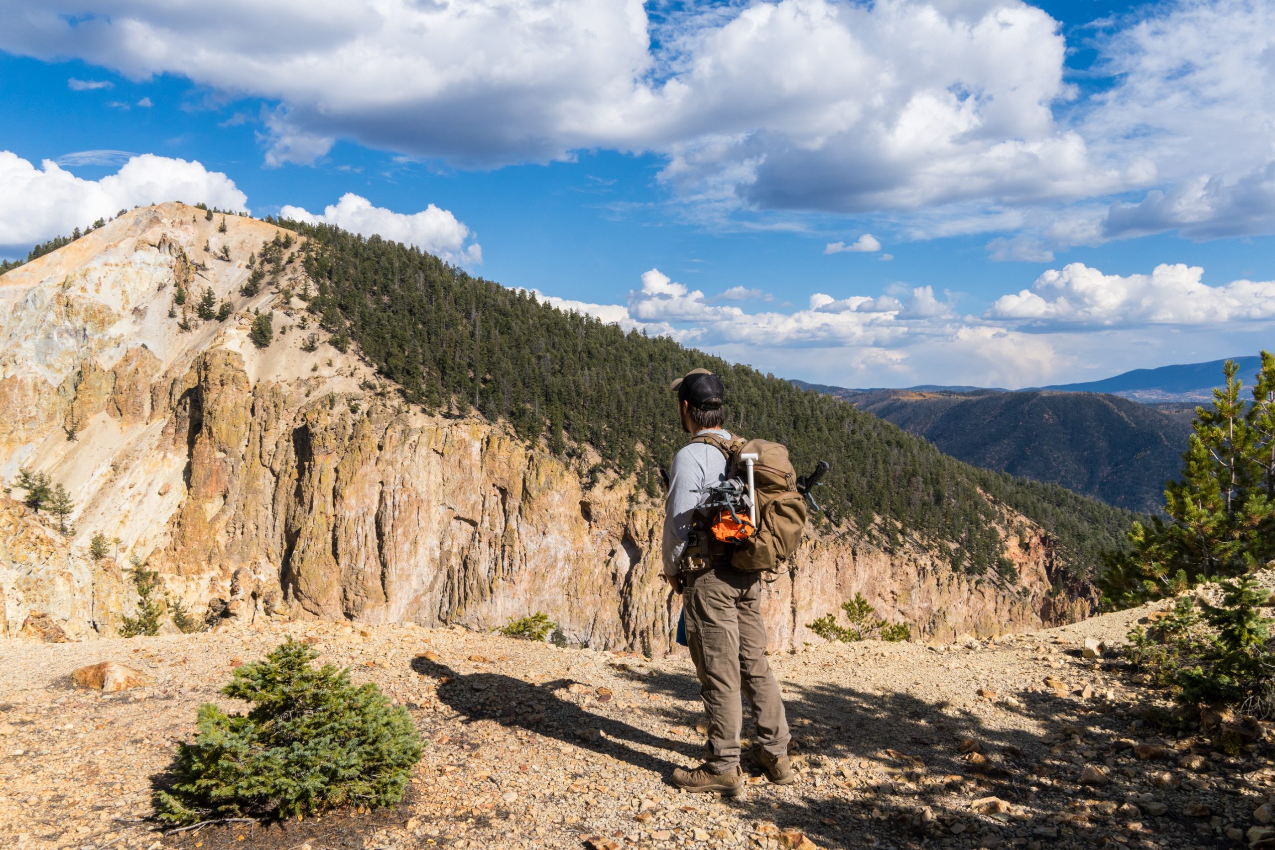 Walking through the landscape to look for a place to set a camera. 